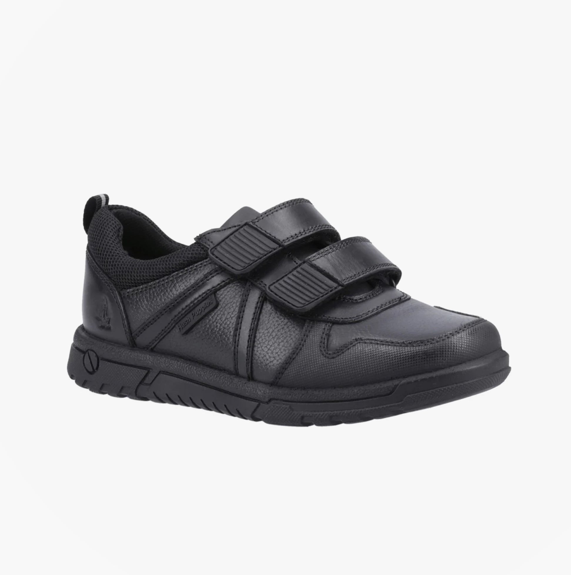 Hush Puppies SPENCER Boys Shoes Black side view showing touch fastening, low top design and rubber sole.