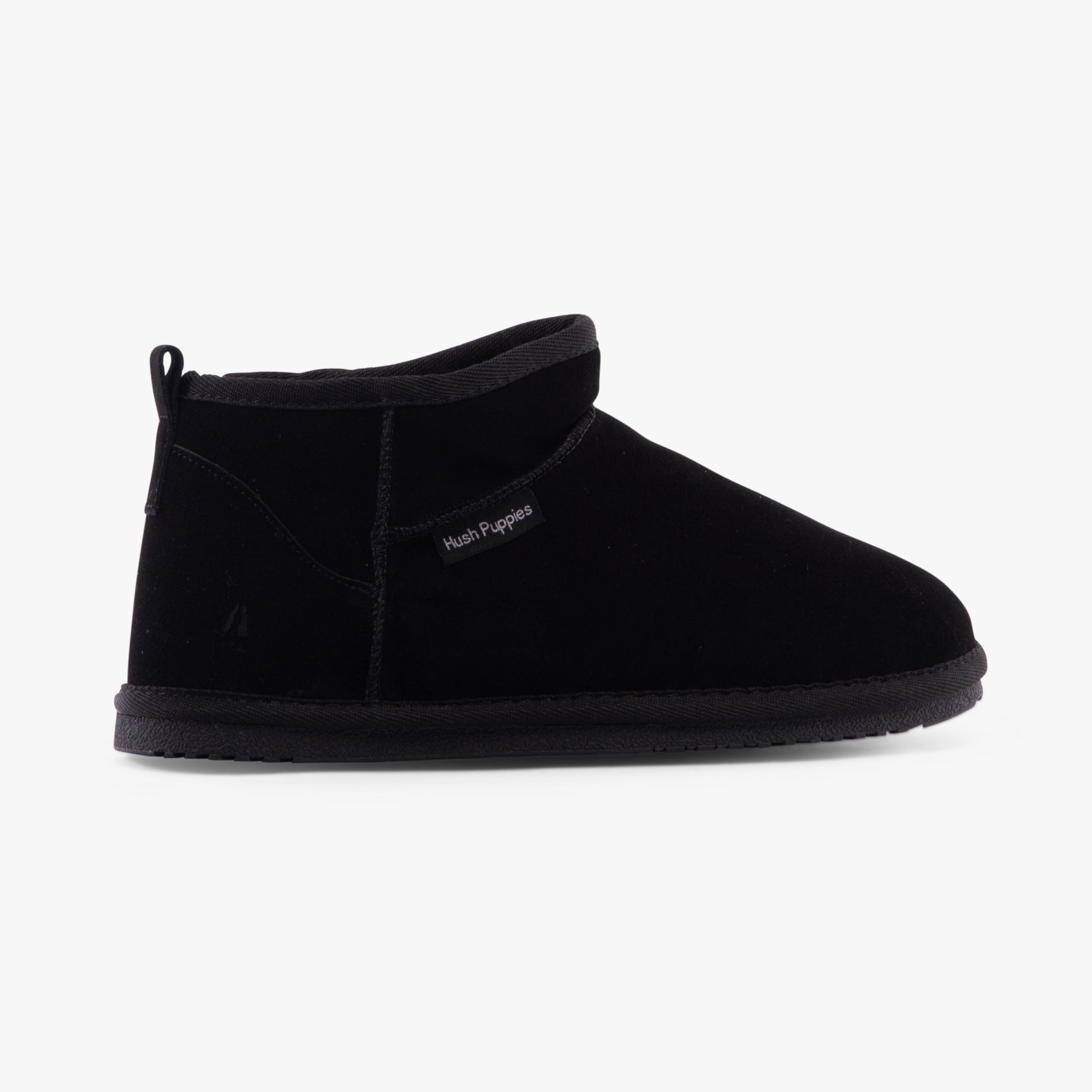 Hush Puppies ASHANTI Womens Slippers Black side view showing the soft suede upper and round toe design.