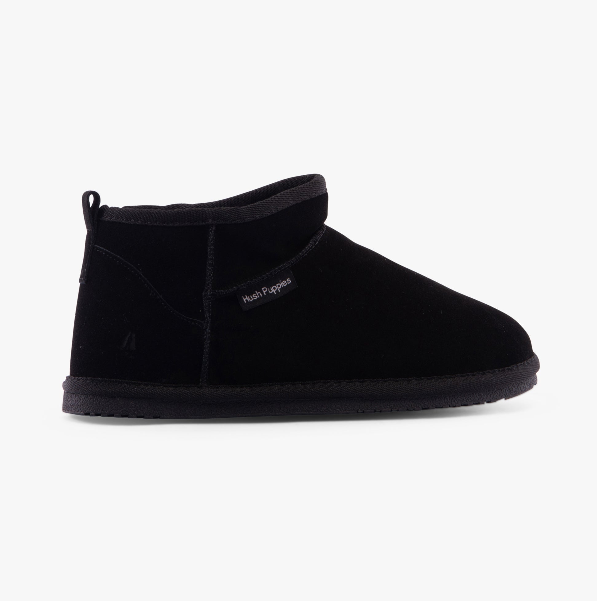 Hush Puppies ASHANTI Womens Slippers Black side view showing the soft suede upper and round toe design.