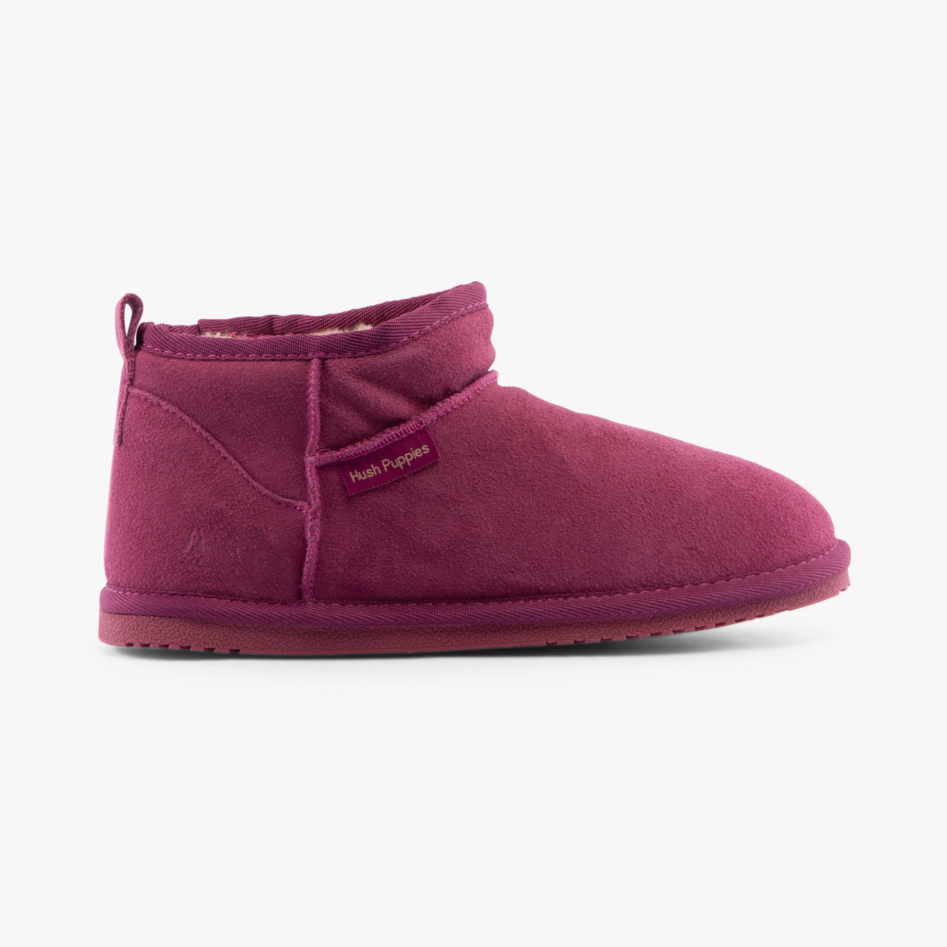 Hush Puppies ASHANTI Womens Slippers Pink side view showing suede upper and faux fur lining for comfort.
