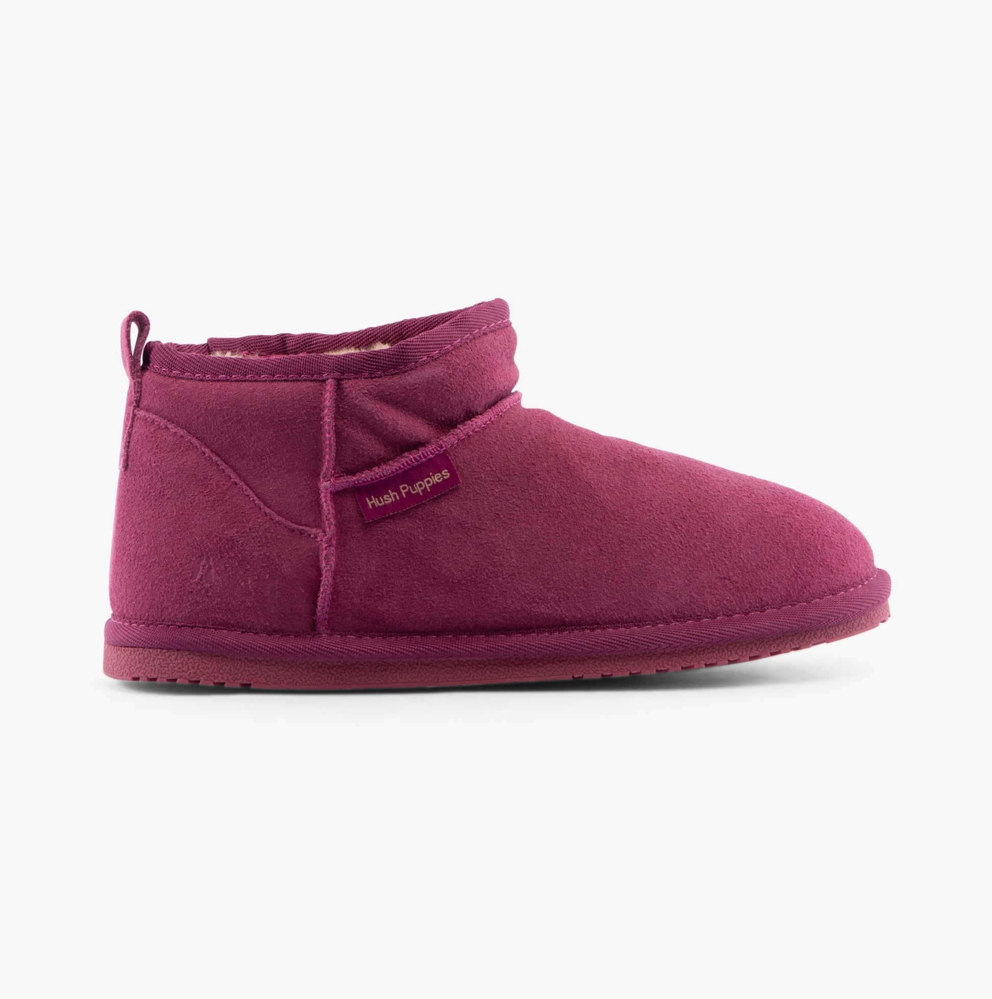 Hush Puppies ASHANTI Womens Slippers Pink side view showing suede upper and faux fur lining for comfort.