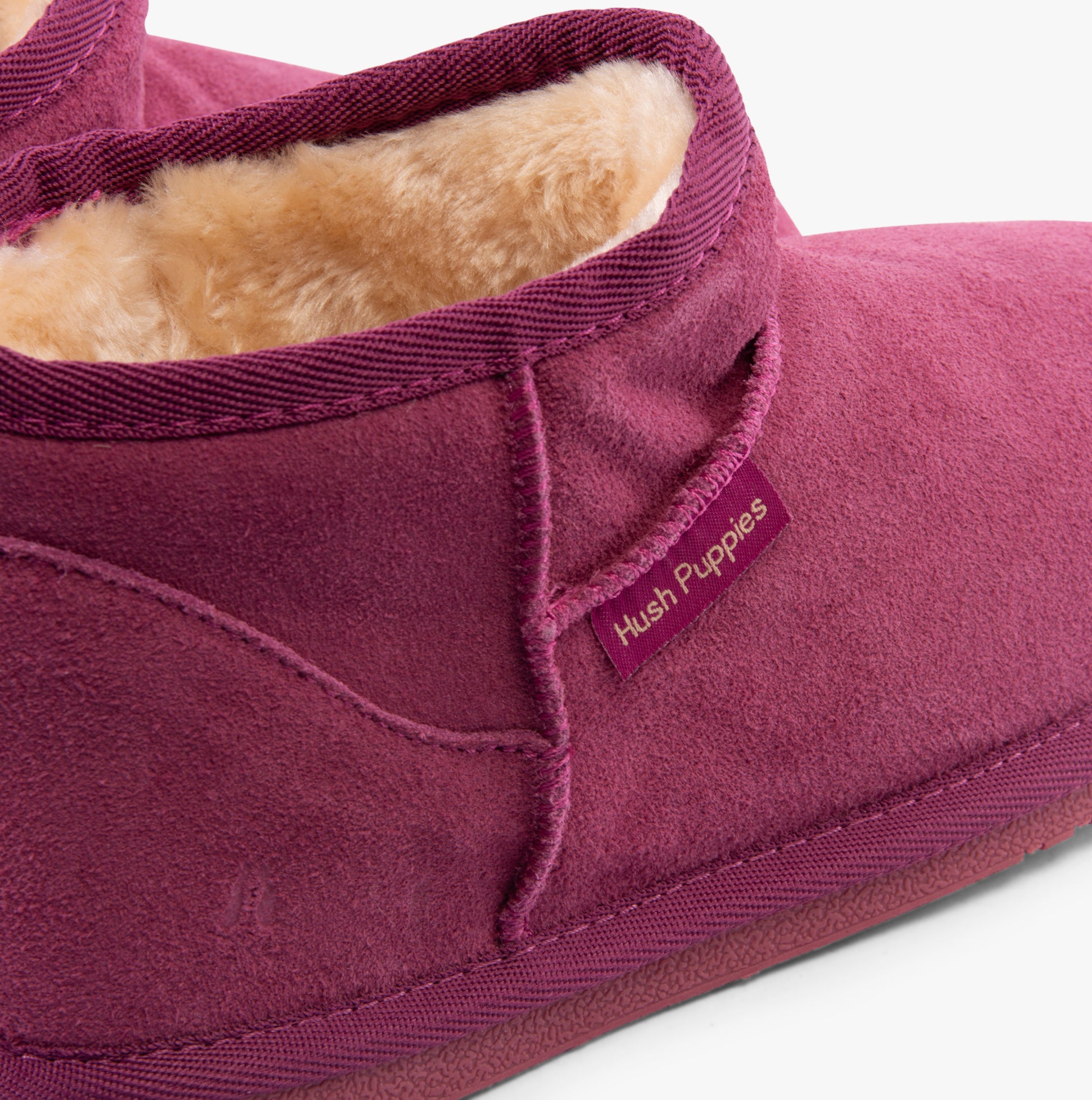 Hush Puppies ASHANTI Womens Slippers Pink detail view featuring suede upper and faux fur lining.