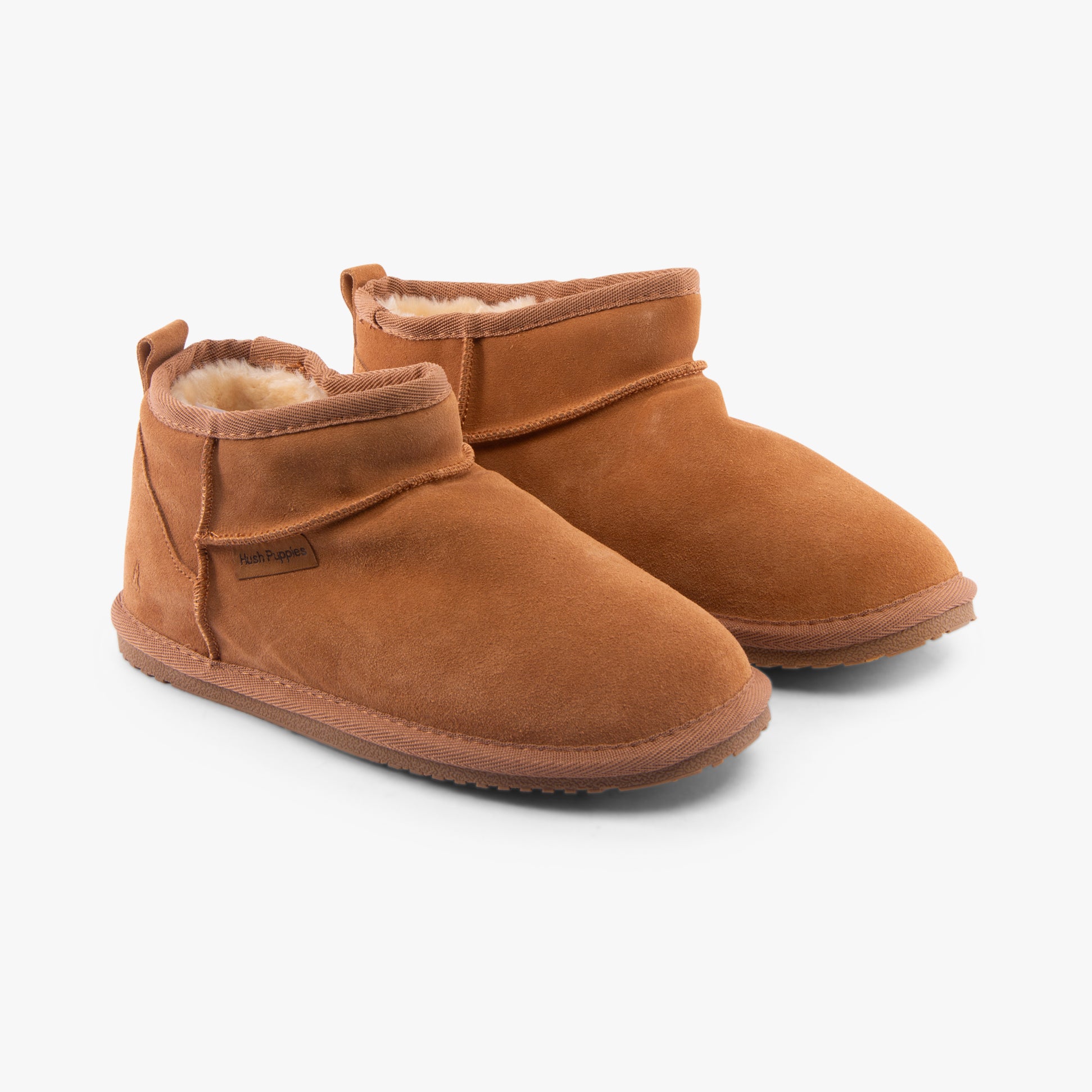 Hush Puppies ASHANTI Womens Slippers Tan side view showcasing soft suede upper and faux fur lining.