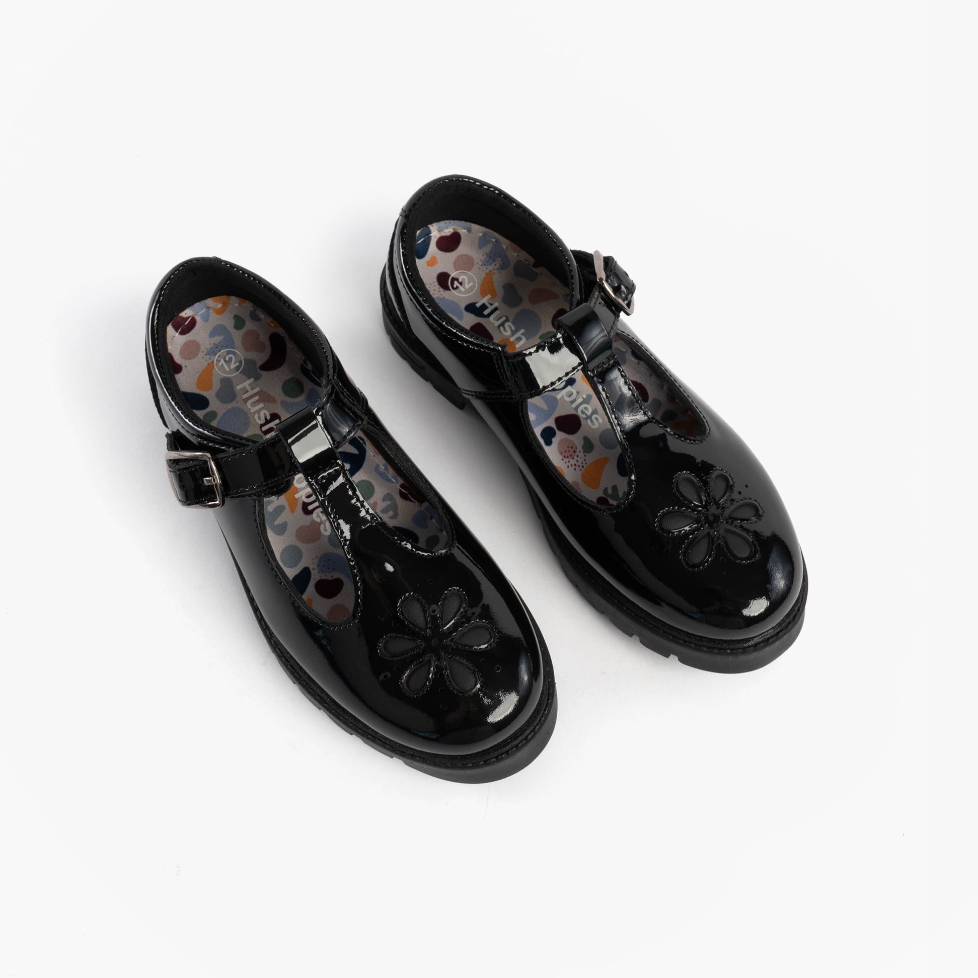 Hush Puppies FIONA Girls Leather School Shoes Patent Black top view showing floral detail and buckle closure.