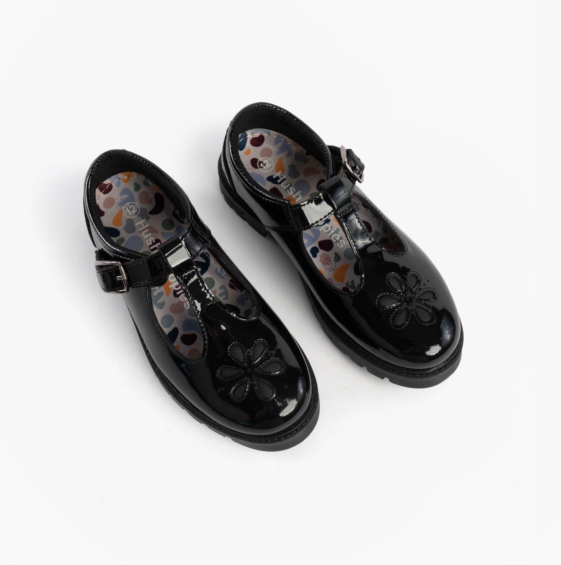Hush Puppies FIONA Girls Leather School Shoes Patent Black top view showing floral detail and buckle closure.