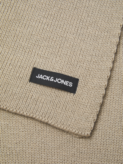 Detail view of Jack & Jones DNA Mens Hat & Scarf Pure Cashmere with label on beige fabric.