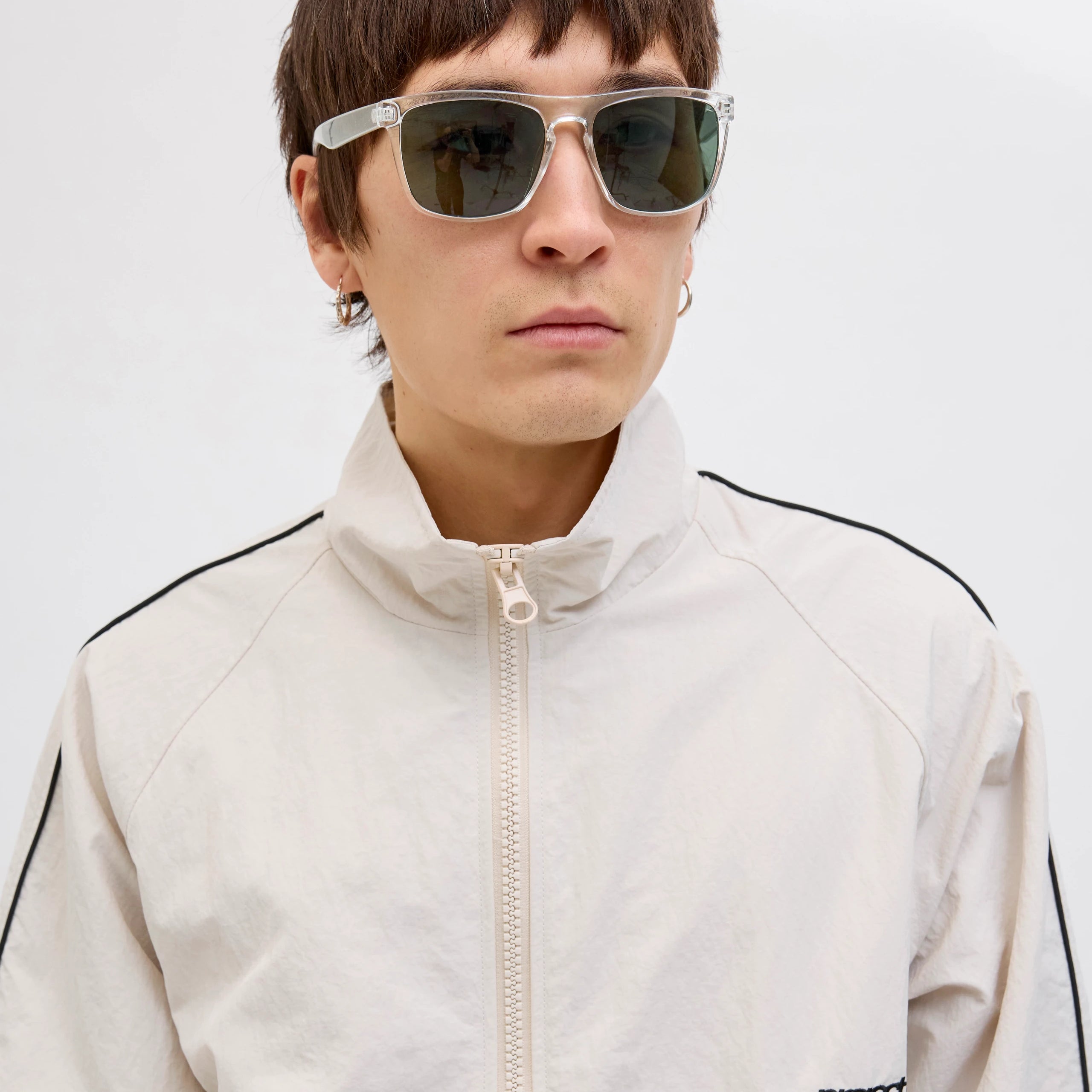 Jack & Jones RYDER Mens Sunglasses Blanc de Blanc front view on model with light jacket.