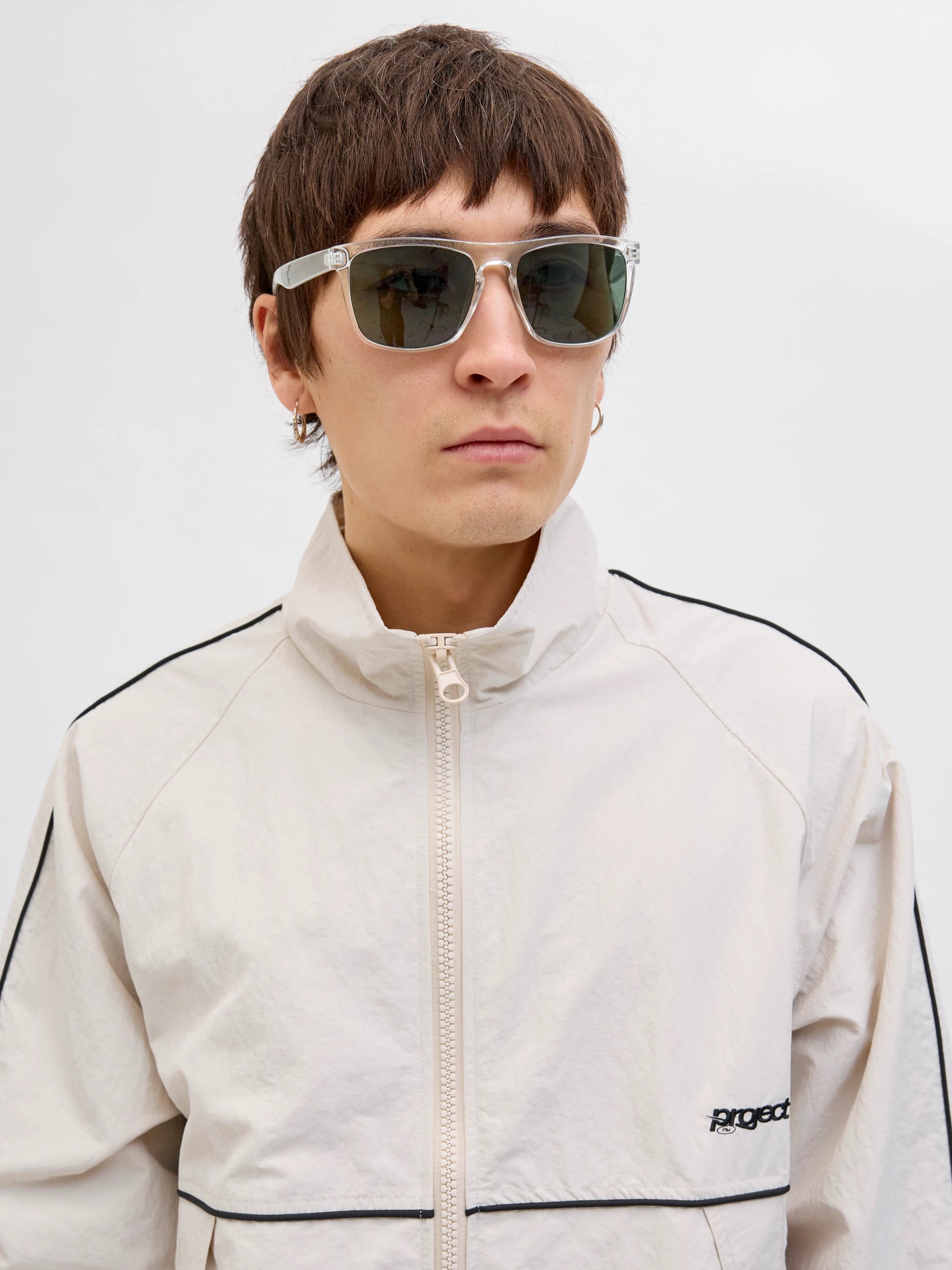 Jack & Jones RYDER Mens Sunglasses Blanc de Blanc front view on model with light jacket.
