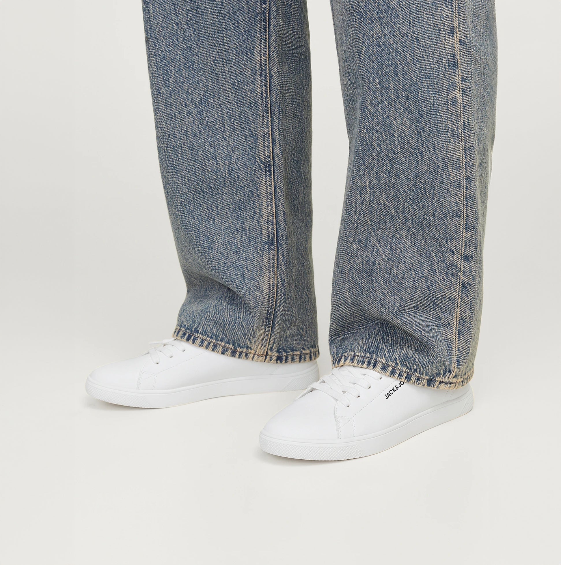 Jack & Jones BOSLEY PU Mens Trainers White side view worn with casual denim jeans