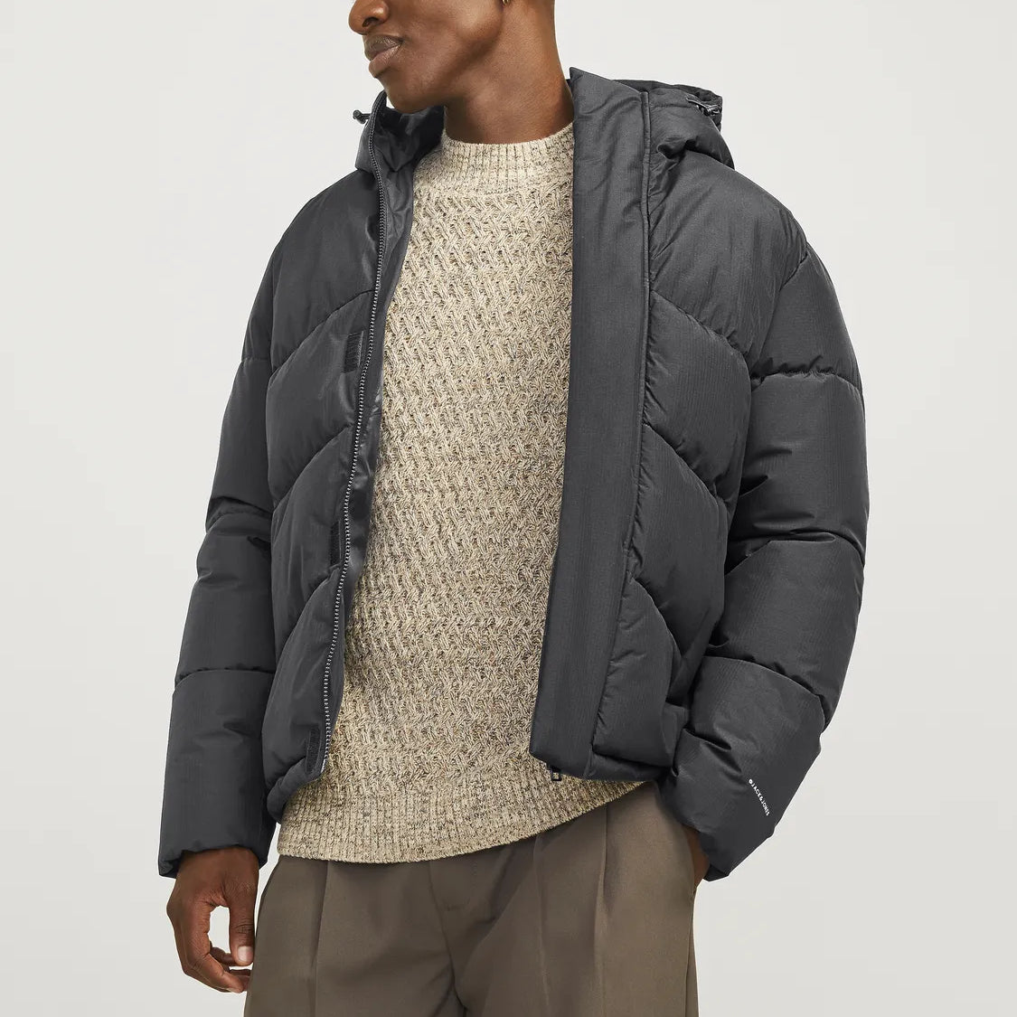 Jack & Jones WORLD Mens Puffer Jacket Asphalt front view on model showcasing adjustable hood and warm padding.