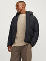 Jack & Jones WORLD Mens Puffer Jacket Black front view on model with adjustable hood and warm padding.