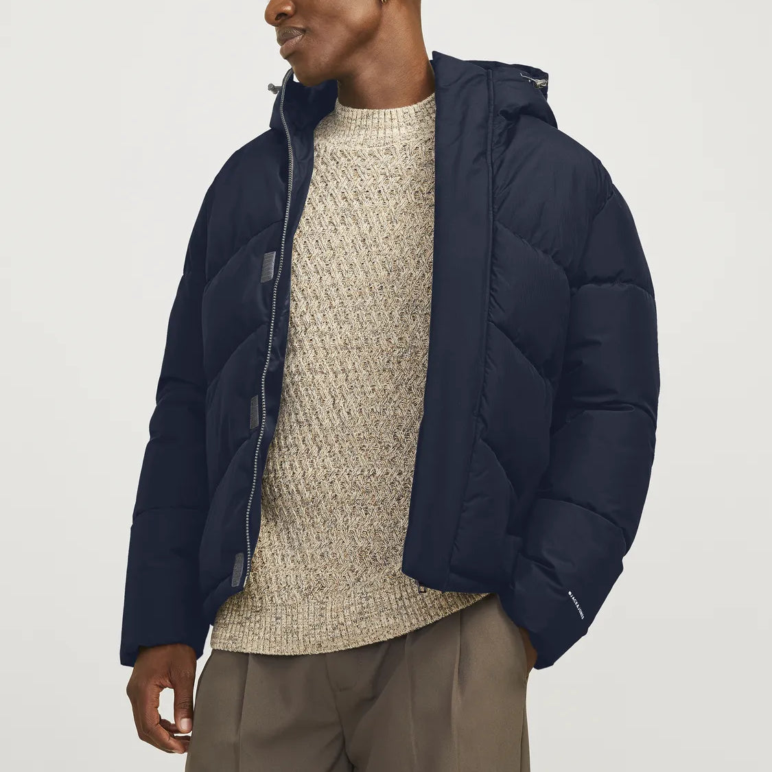 Jack & Jones WORLD Mens Puffer Jacket Navy Blazer front view worn by a model, showcasing its stylish design and hood.