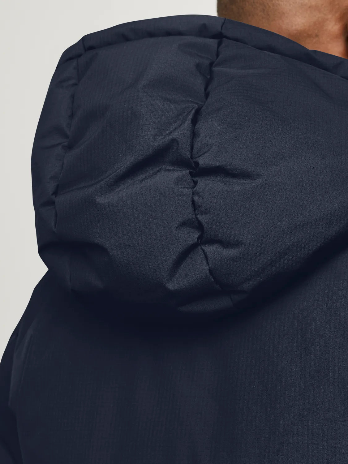 Jack & Jones WORLD Mens Puffer Jacket Navy Blazer detail view of adjustable hood and texture