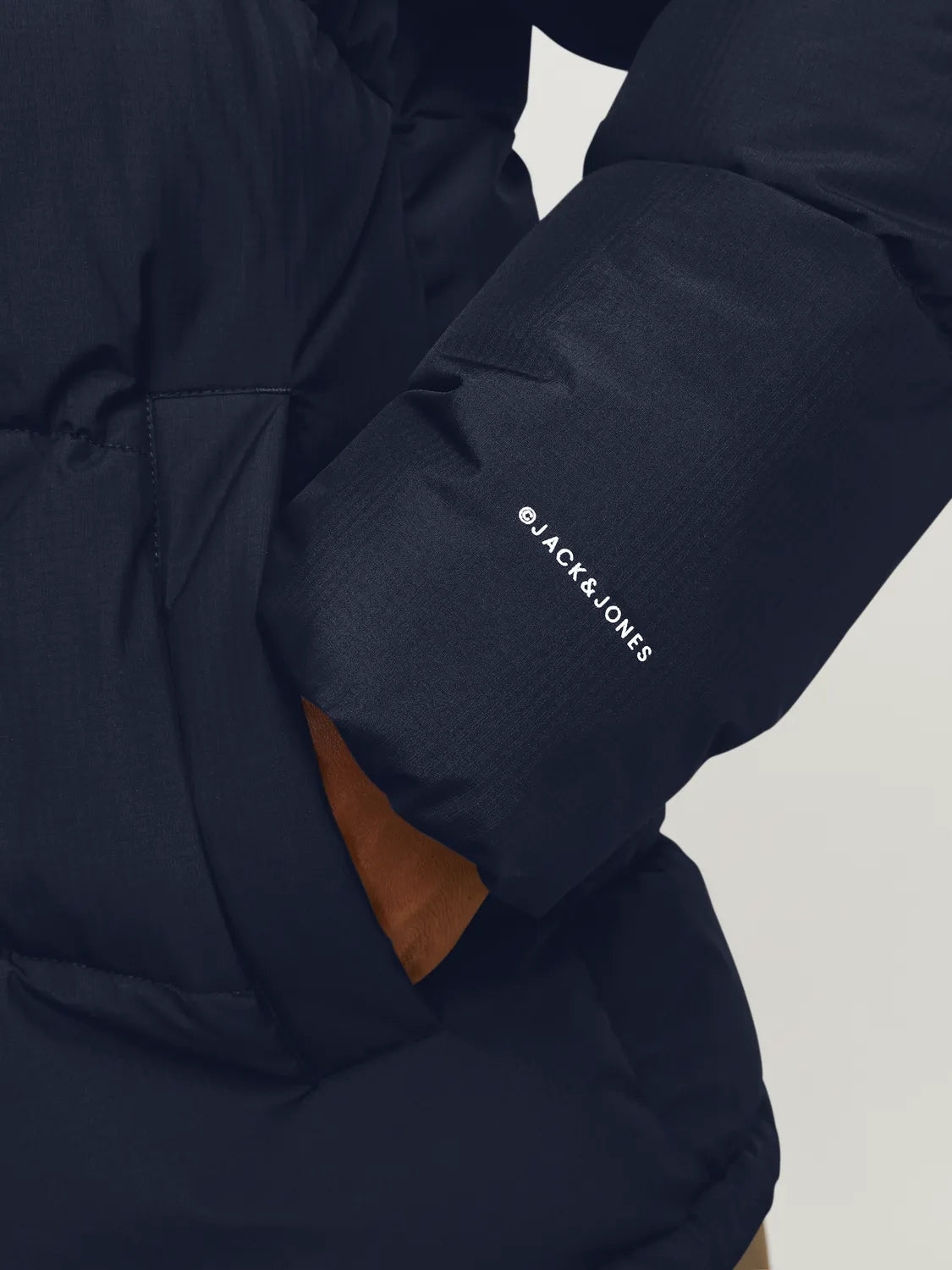 Jack & Jones WORLD Mens Puffer Jacket Navy Blazer detail view of sleeve and logo