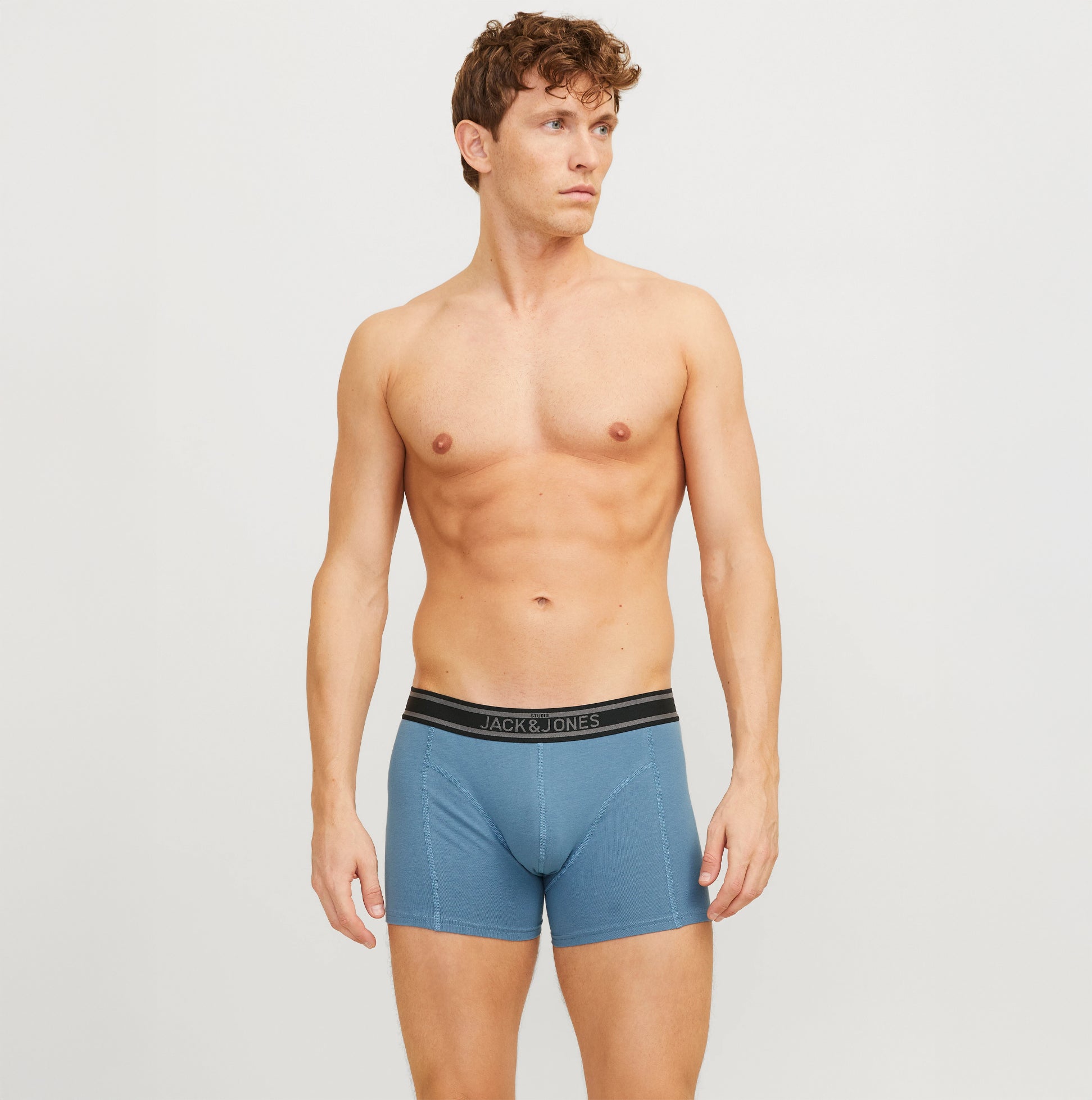 Jack & Jones JACRICHARD 3 Pack Mens Trunks Black front view modeled by a male wearing the trunks with branded elasticated waistband.
