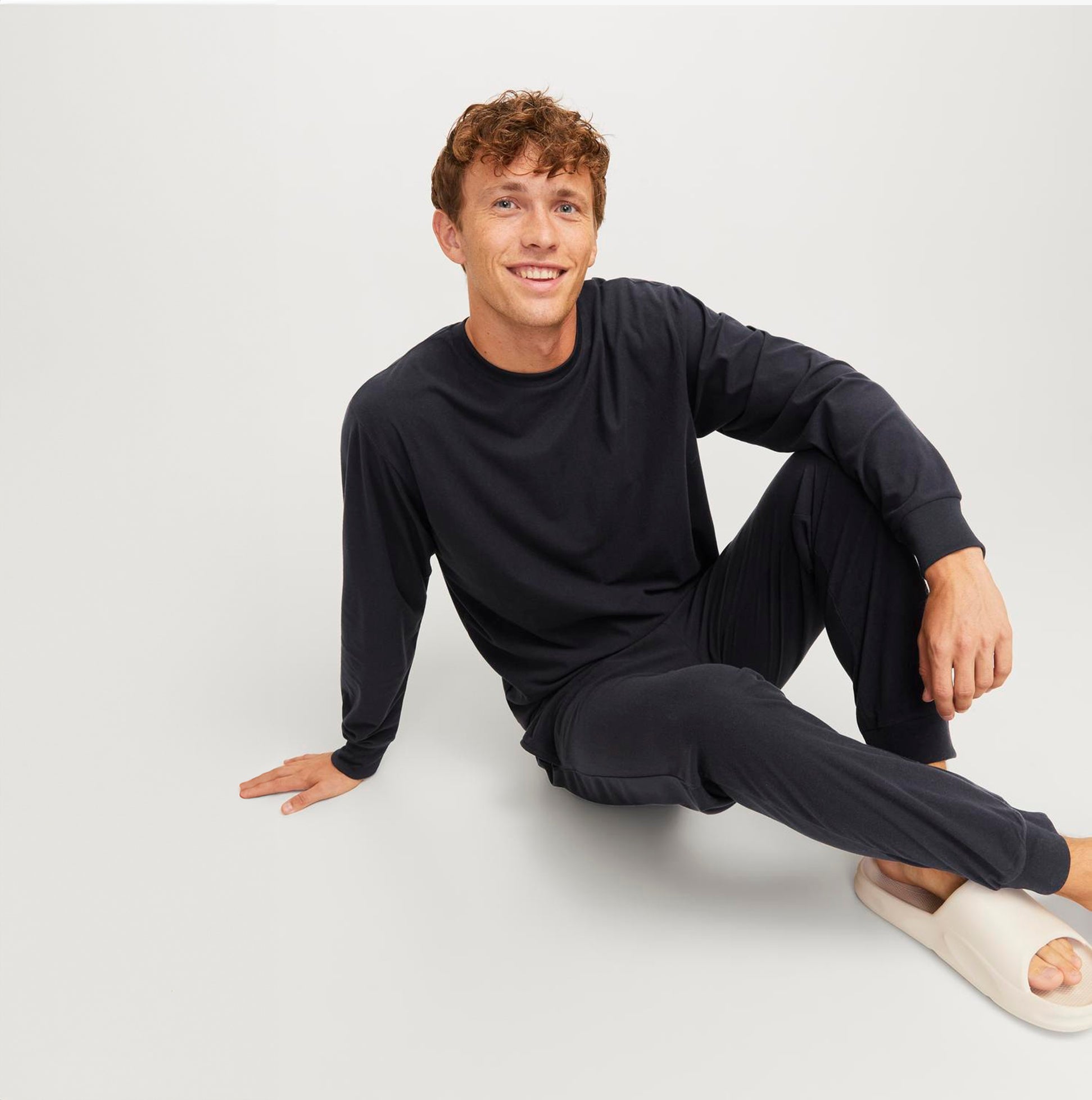 Jack & Jones SOLID LOUNGE Set Mens Black front view, showing comfortable loungewear in black, model sitting.