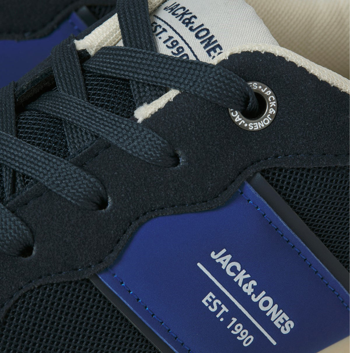 Detail view of Jack & Jones SPIRIT RUNNER Mens Trainers Medieval Blue showcasing laces and branding.