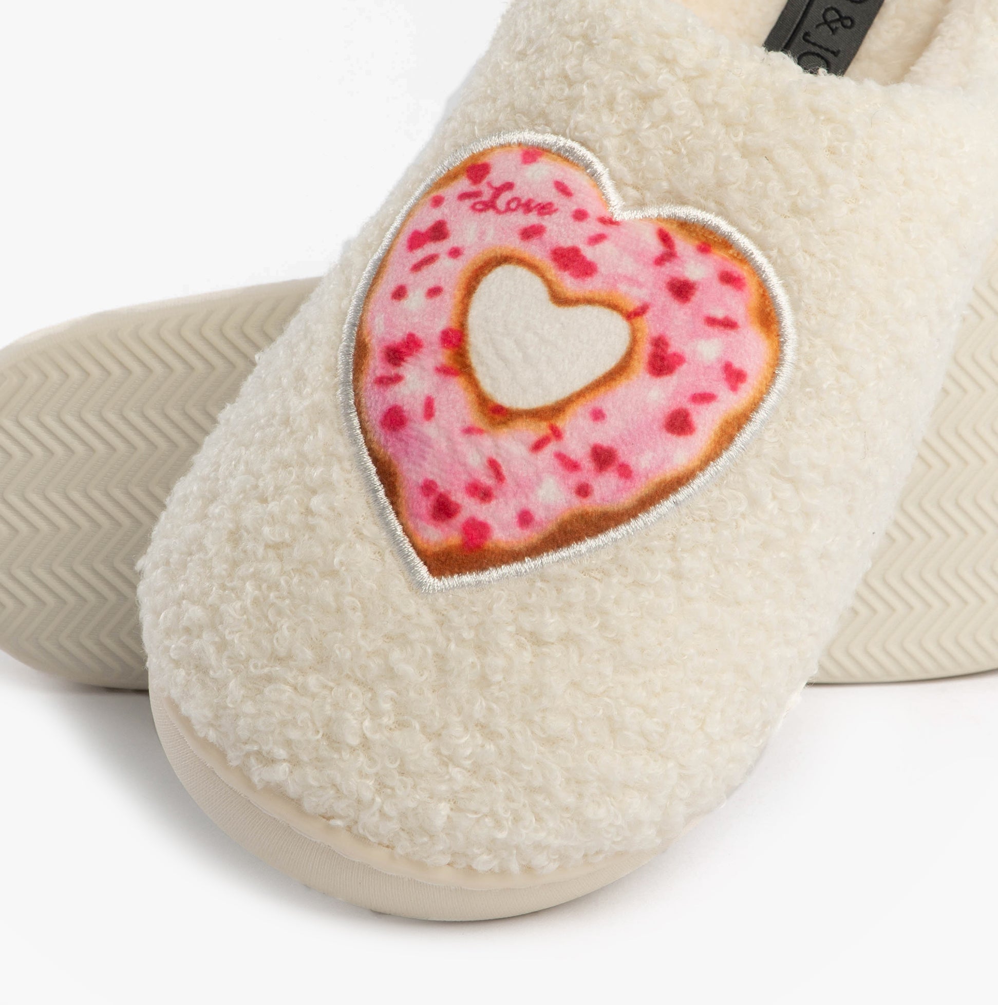 Jo & Joe DELIGHT Womens Mule Slippers Cream detail view with heart donut design on fluffy upper.