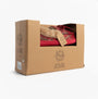 Jo & Joe PEMBROKE Womens Moccasin Slippers Festive Red in gift box, side view showcasing the packaging.