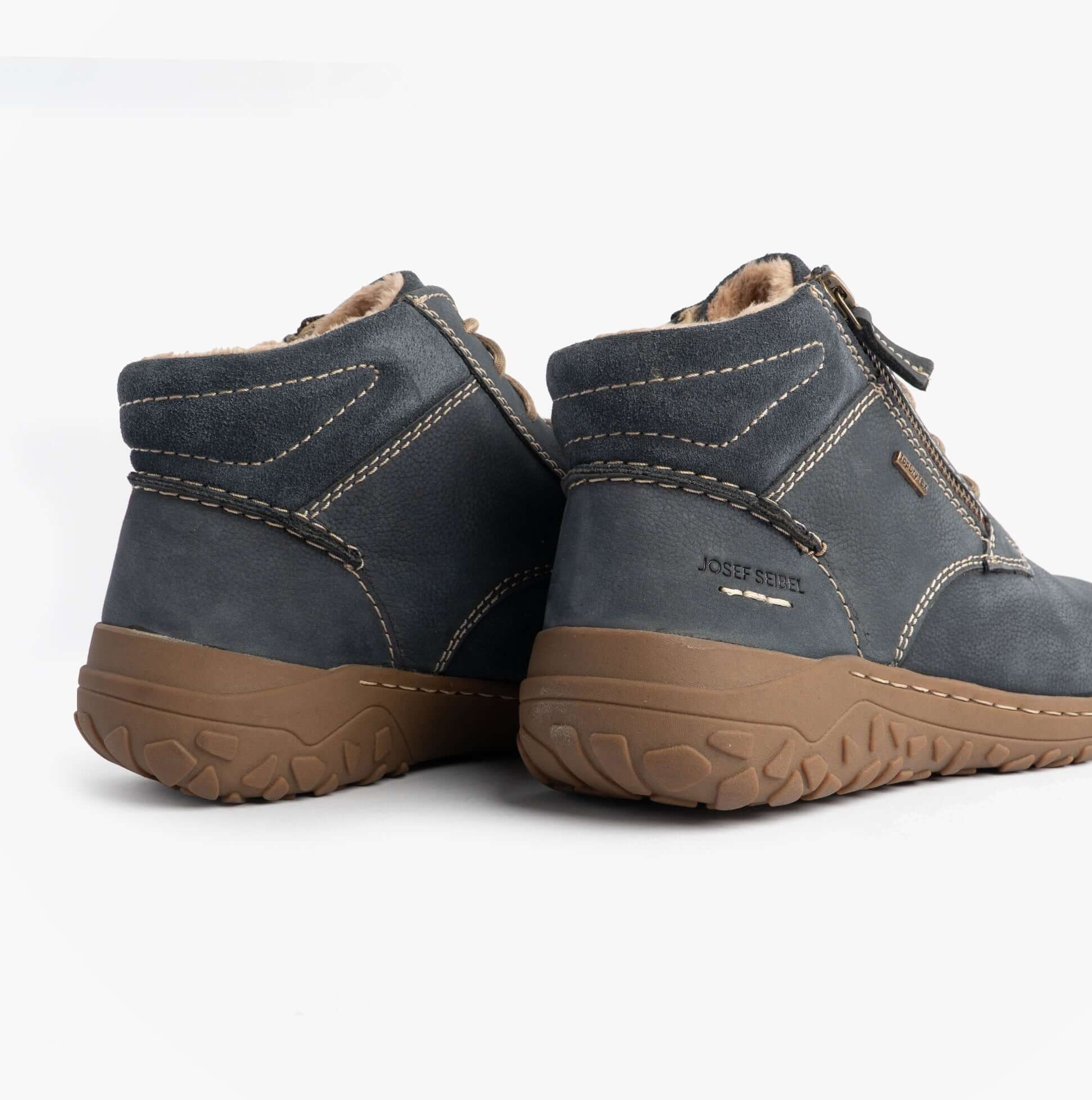 Josef Seibel RUBY 54 Ladies Boots Indigo Blue rear view showing ankle height and rubber sole details.
