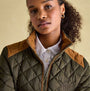 Joules BRAEMAR LUXE Womens Quilted Jacket Green front view with funnel neck and suedette shoulders.
