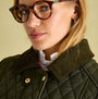 Joules ROSEWELL Womens Longline Quilted Showerproof Coat Green detail view of collar and model wearing glasses