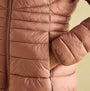 Detail view of Joules KENLEY Womens Showerproof Hooded Puffer Jacket Pink showcasing zip closure and pocket.