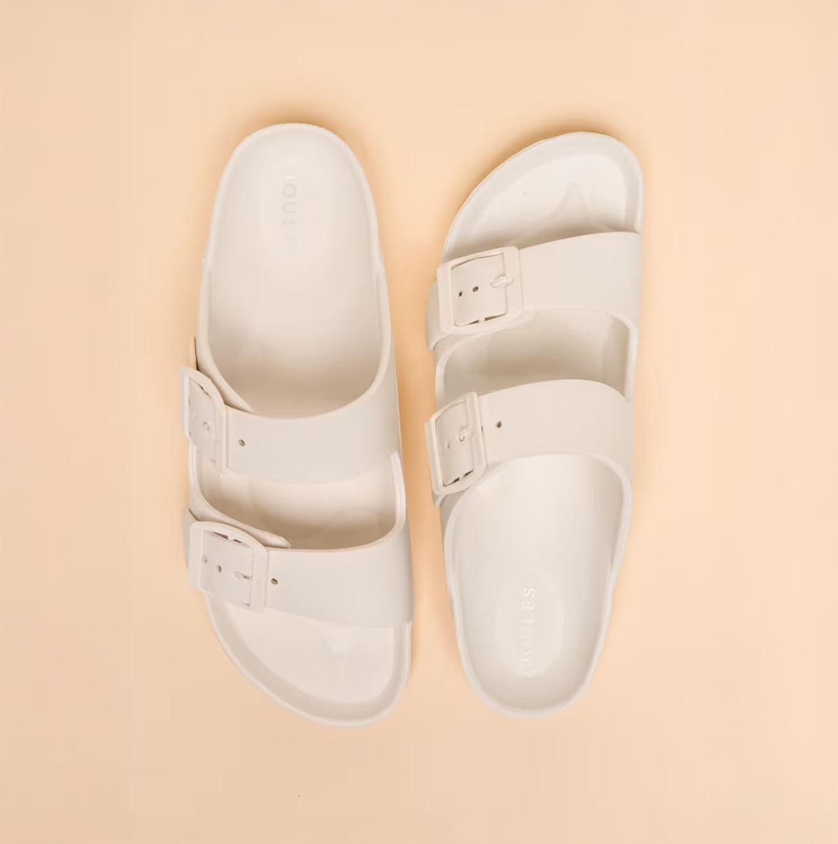 Joules SUNSEEKER Womens Sliders White top view showcasing slip-on design with triple buckle straps.