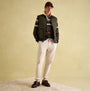Joules GIBSON Mens Gilet Green, front view, worn over a striped shirt, styled with cream pants, presented on neutral background.