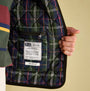Joules GIBSON Mens Gilet Green detail view showing the quilted inner lining and label design.