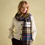 Joules LANGTREE Womens Scarf Green Pink Check styled with a cream cardigan, showcasing the checked pattern and tasselled ends.