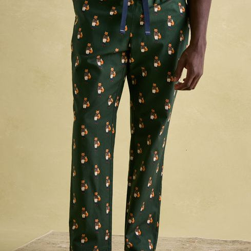 Joules DOZER Pyjama Bottoms Fenton Fox side view showcasing relaxed fit and cotton material in green with fox pattern.