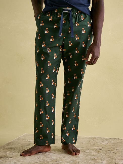 Joules DOZER Pyjama Bottoms Fenton Fox side view showcasing relaxed fit and cotton material in green with fox pattern.