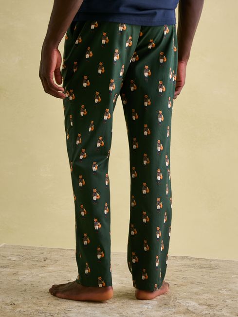 Joules DOZER Pyjama Bottoms Fenton Fox rear view featuring green fabric with fox patterns.