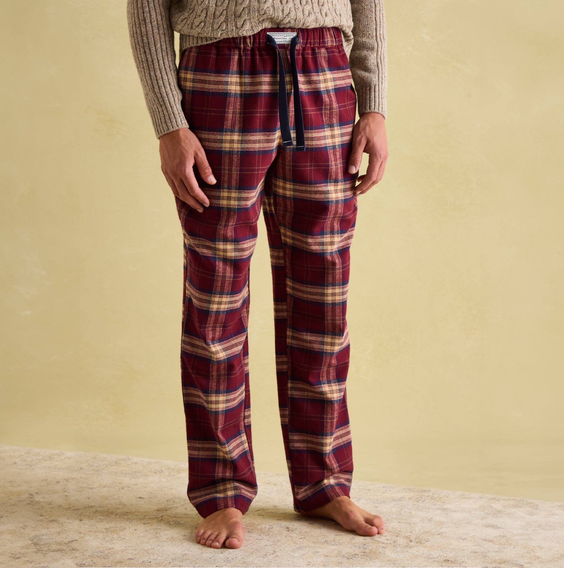 Joules SLEEPER Mens Pyjama Bottoms Red Check front view showcasing relaxed fit, drawcord waist, and checked pattern.