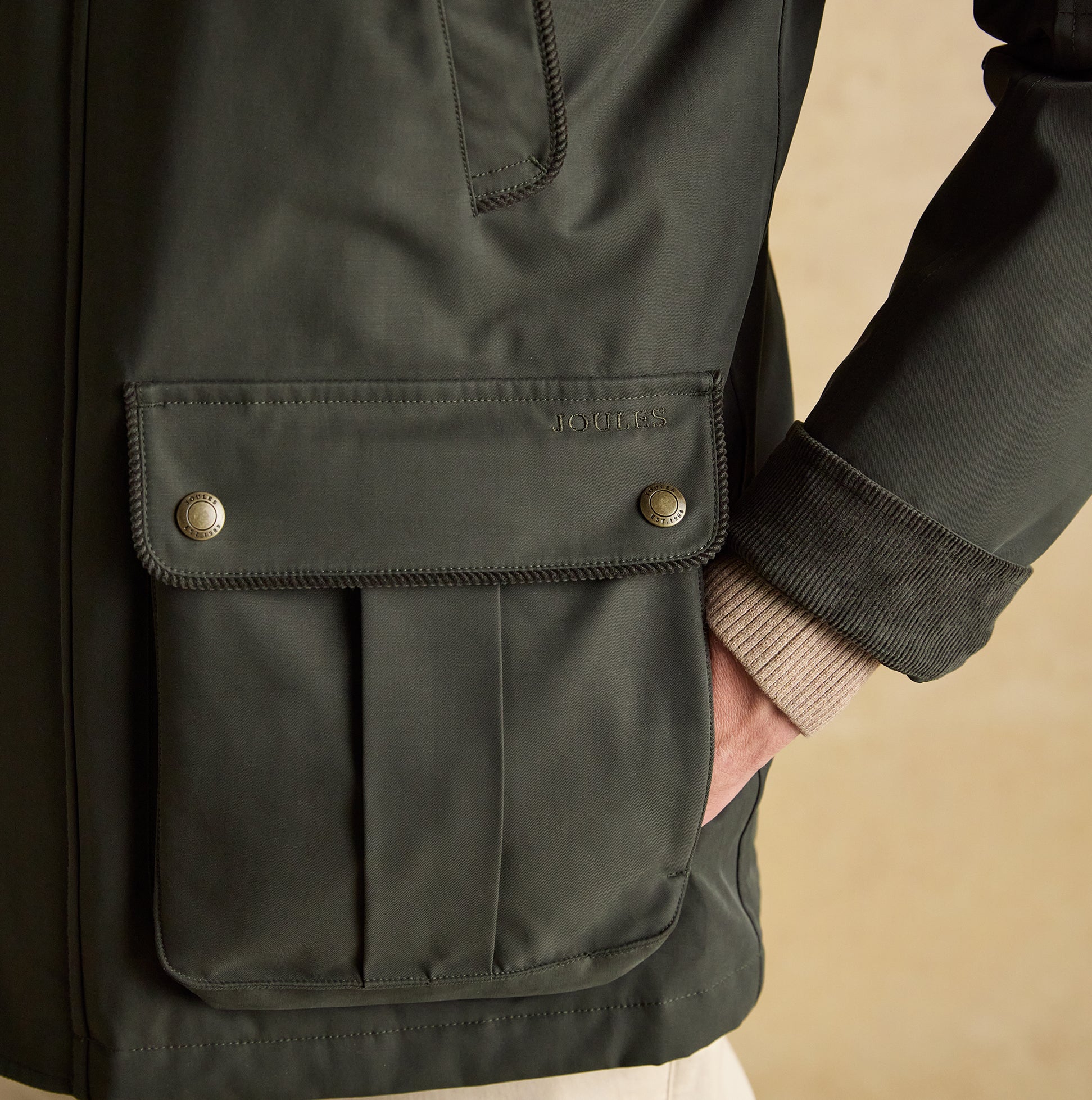 Joules FARLEIGH Mens Waterproof Midweight Country Coat Green side view showing pocket detail and fabric texture.