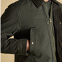 Joules FARLEIGH Mens Waterproof Midweight Country Coat Green detail view showcasing zipper and button closure.