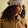 Joules Epwell Womens Waterproof Belted Trench Coat Brown worn by model, side view, showcasing the coat's detail.