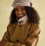 Joules Epwell Womens Waterproof Belted Trench Coat Brown front view with model smiling, wearing hat.
