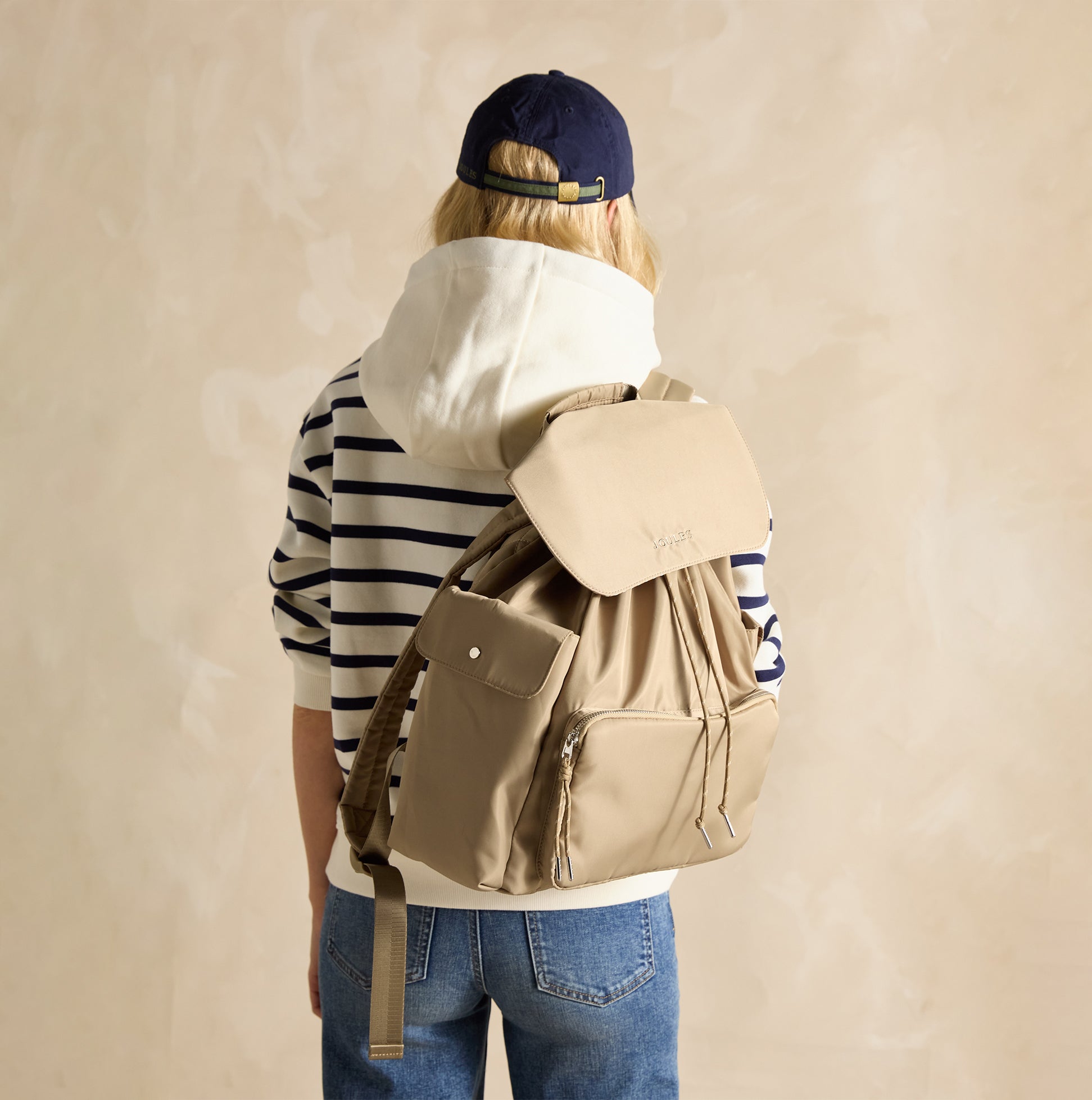 Joules CAMBECK NYLON RUCKSACK Womens NEUTRAL back view on a woman wearing a striped hoodie with adjustable straps.
