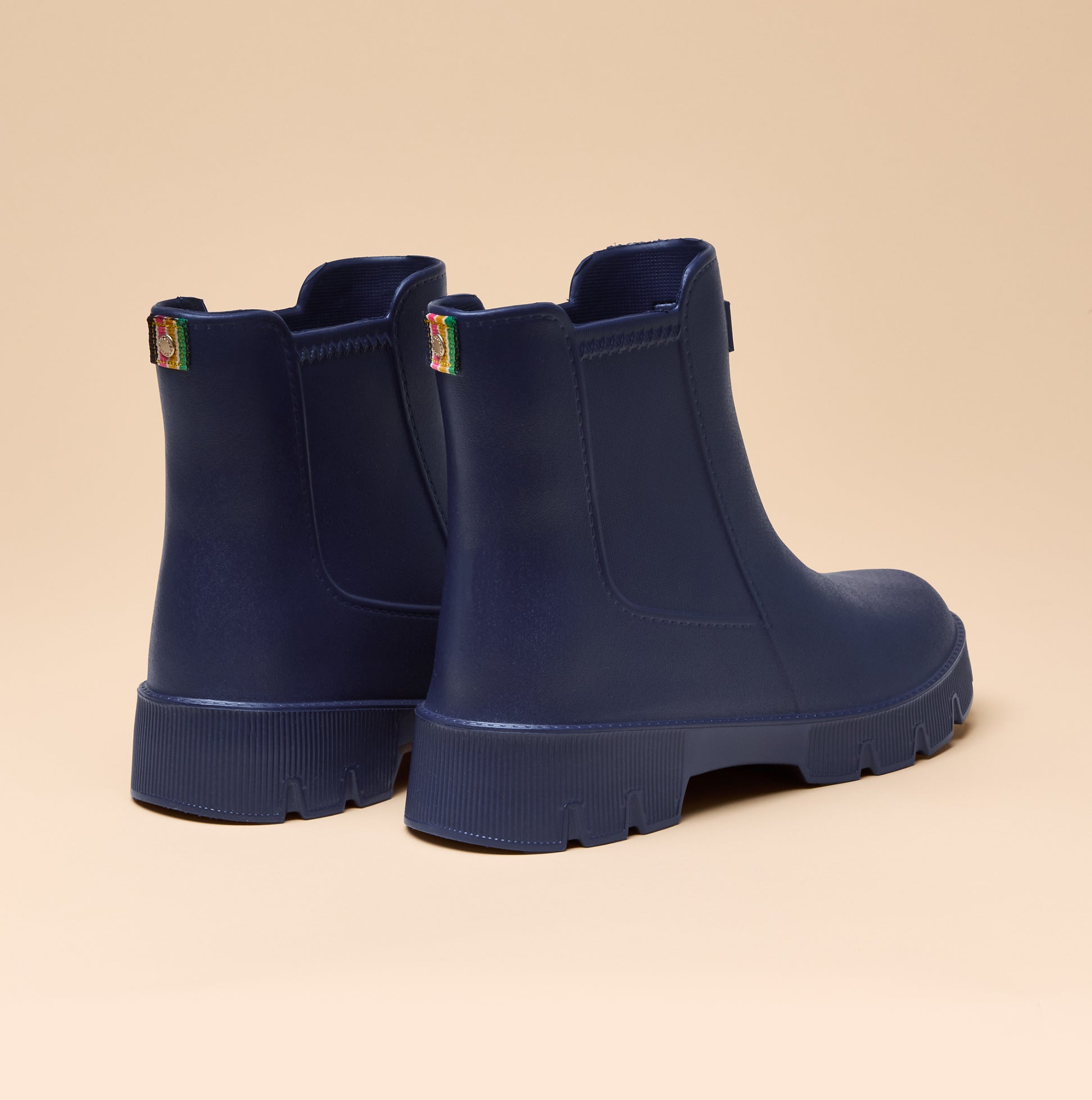 Joules RAINDANCE Lightweight Wellies Navy back view showcasing ankle-height boots with a matte finish and durable sole.