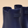 Joules RAINDANCE Lightweight Wellies Navy close-up detail view of the boot's upper showing logo and collar.