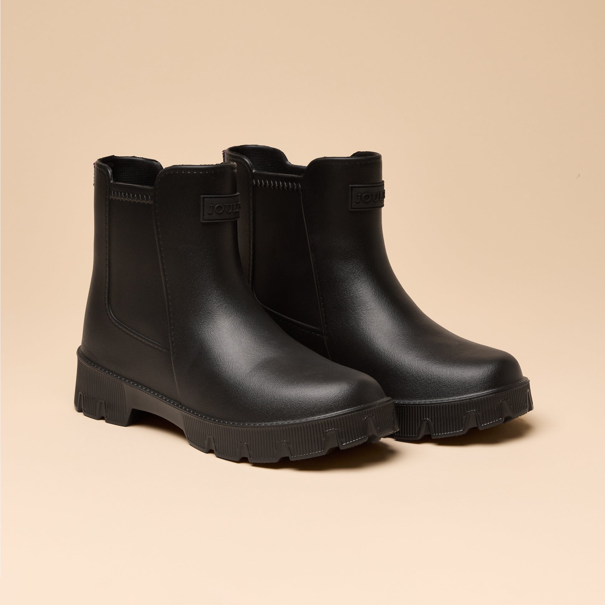 Joules RAINDANCE Lightweight Wellies Black, side view, showing black waterproof ankle boots with round toe and low heel.