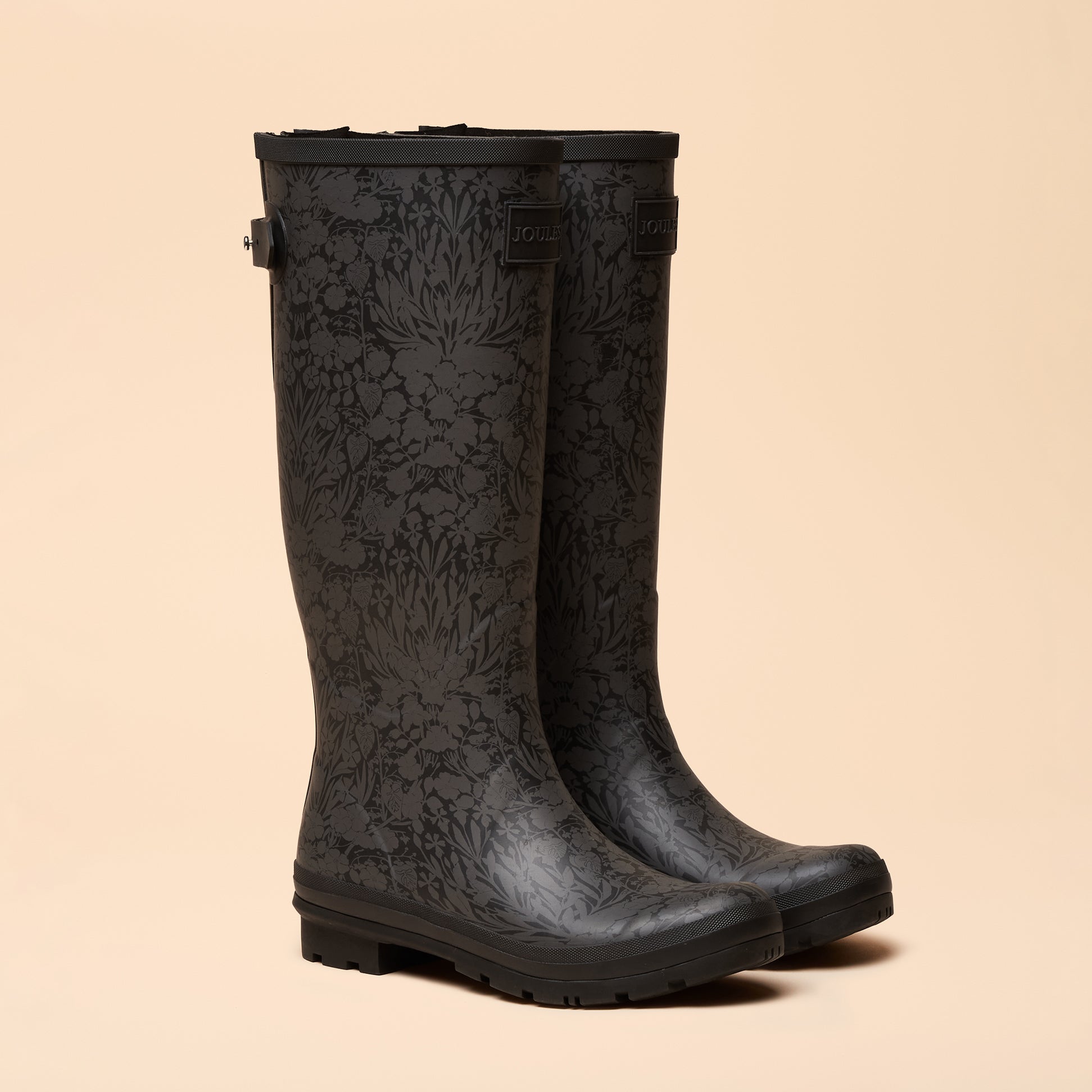 Joules WELLY PRINT Womens Wellington Boots Black side view showing floral pattern and mid-calf height detail.