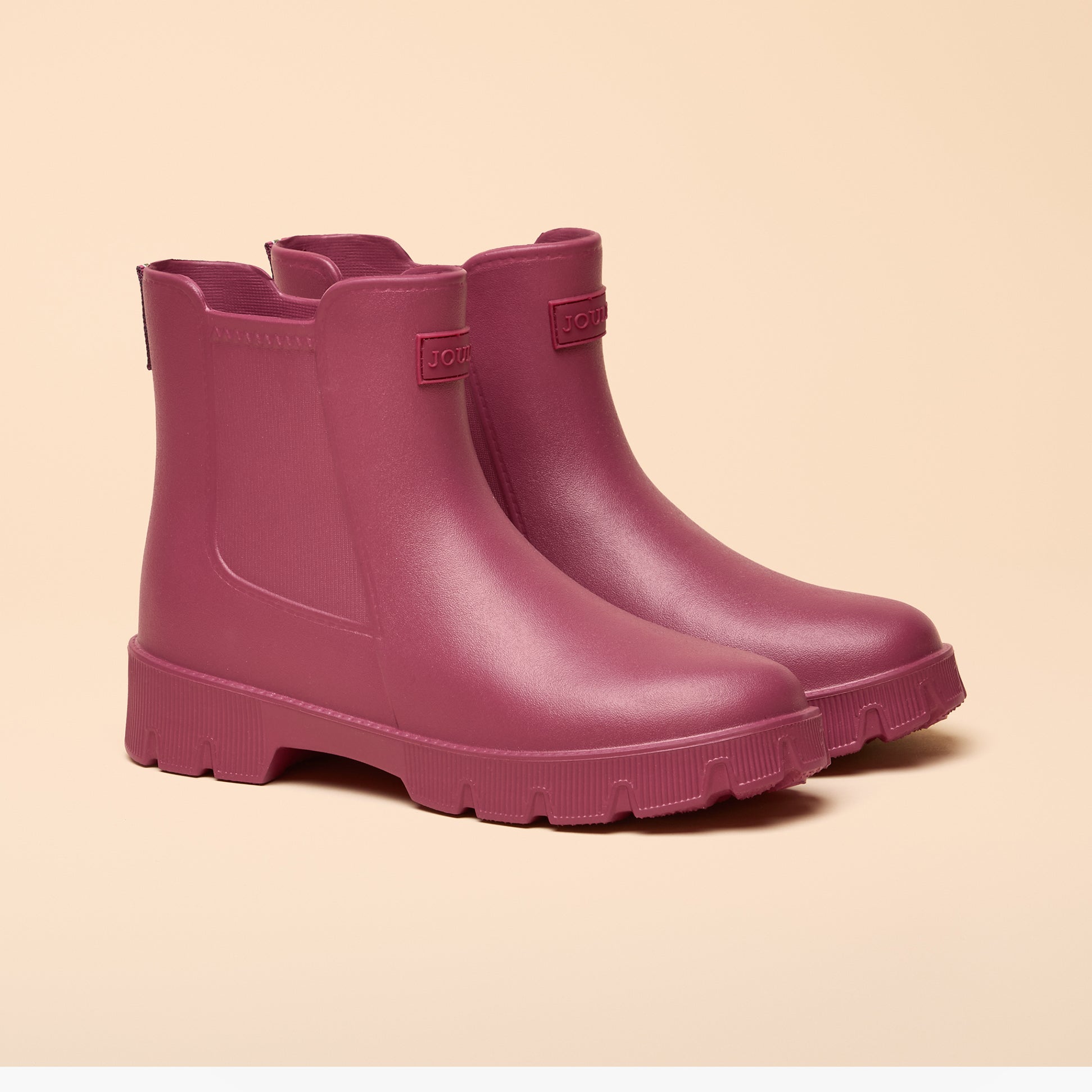 Joules RAINDANCE Lightweight Wellies Berry Red side view on beige background