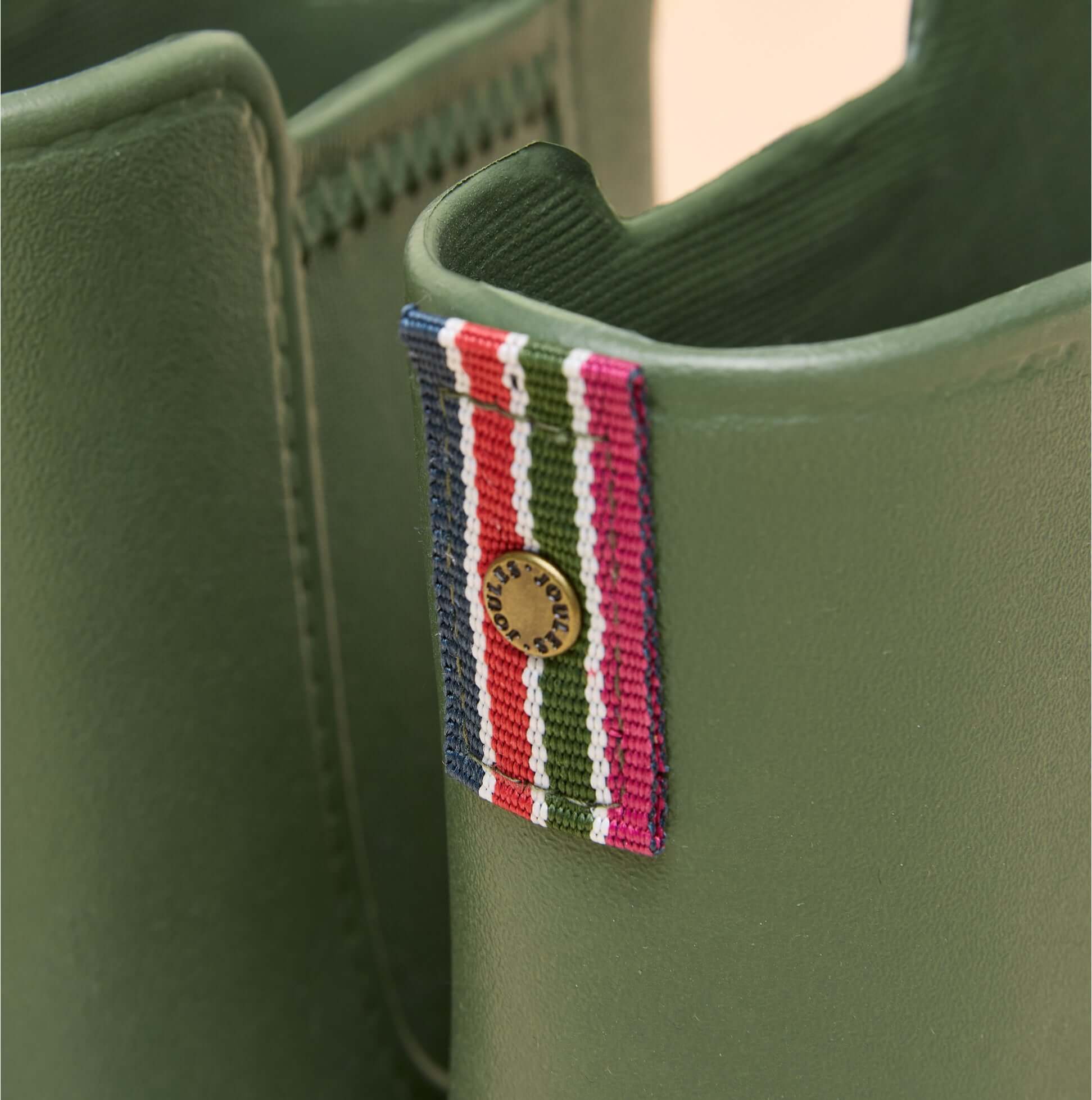 Joules RAINDANCE Lightweight Wellies Khaki Green detail view showing the patterned tag on the boot's upper.