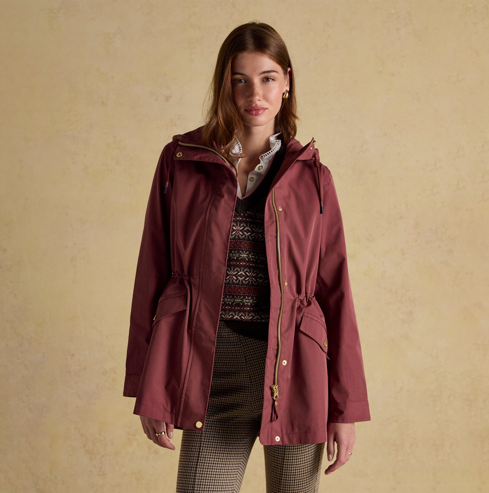 Joules PORTWELL Waterproof Hoodie Raincoat With Adjustable Waist Oxblood front view, showcasing hood and adjustable waist features.