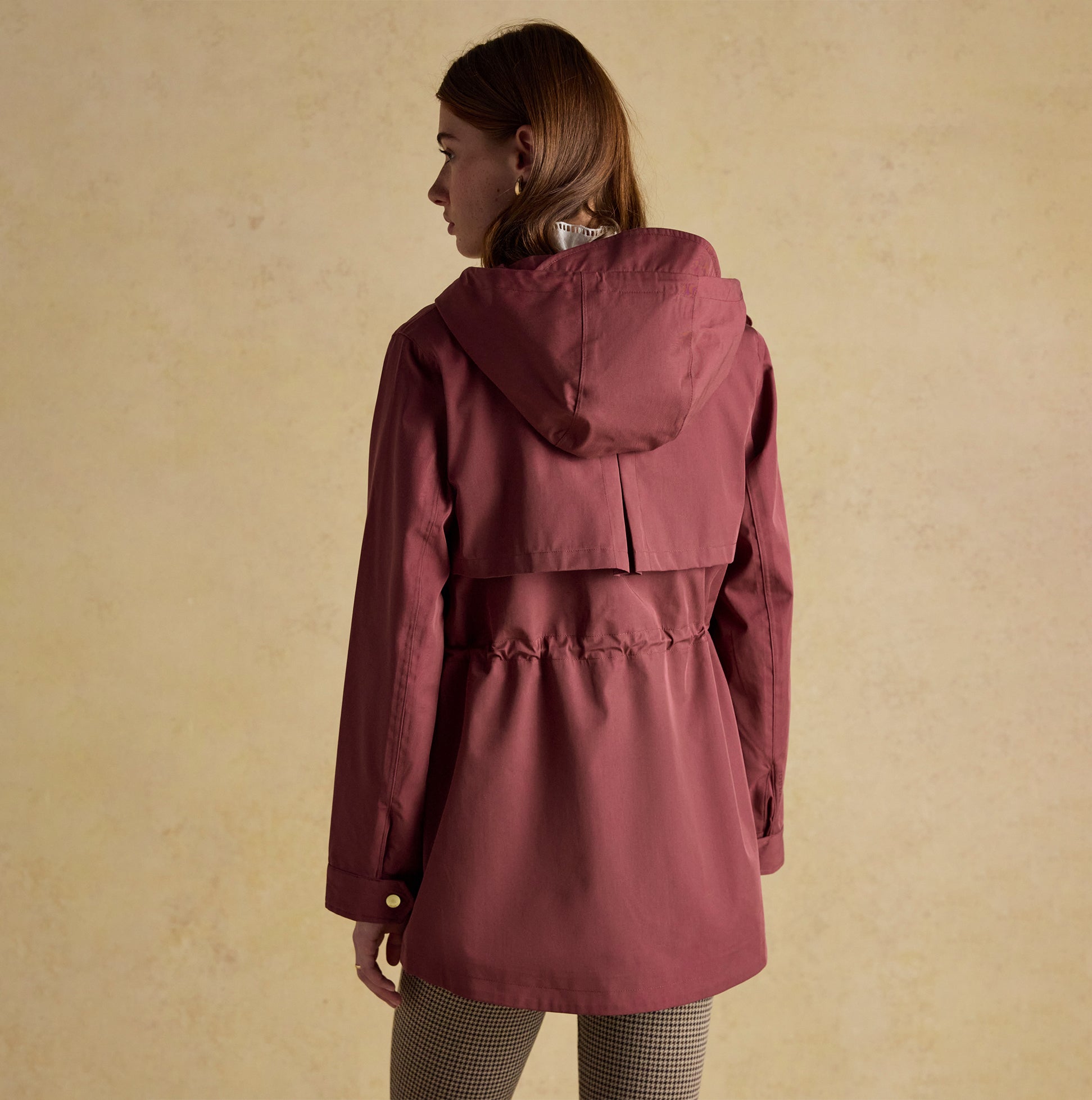 Joules PORTWELL Waterproof Hoodie Raincoat With Adjustable Waist Oxblood back view showcasing the fitted waist design.