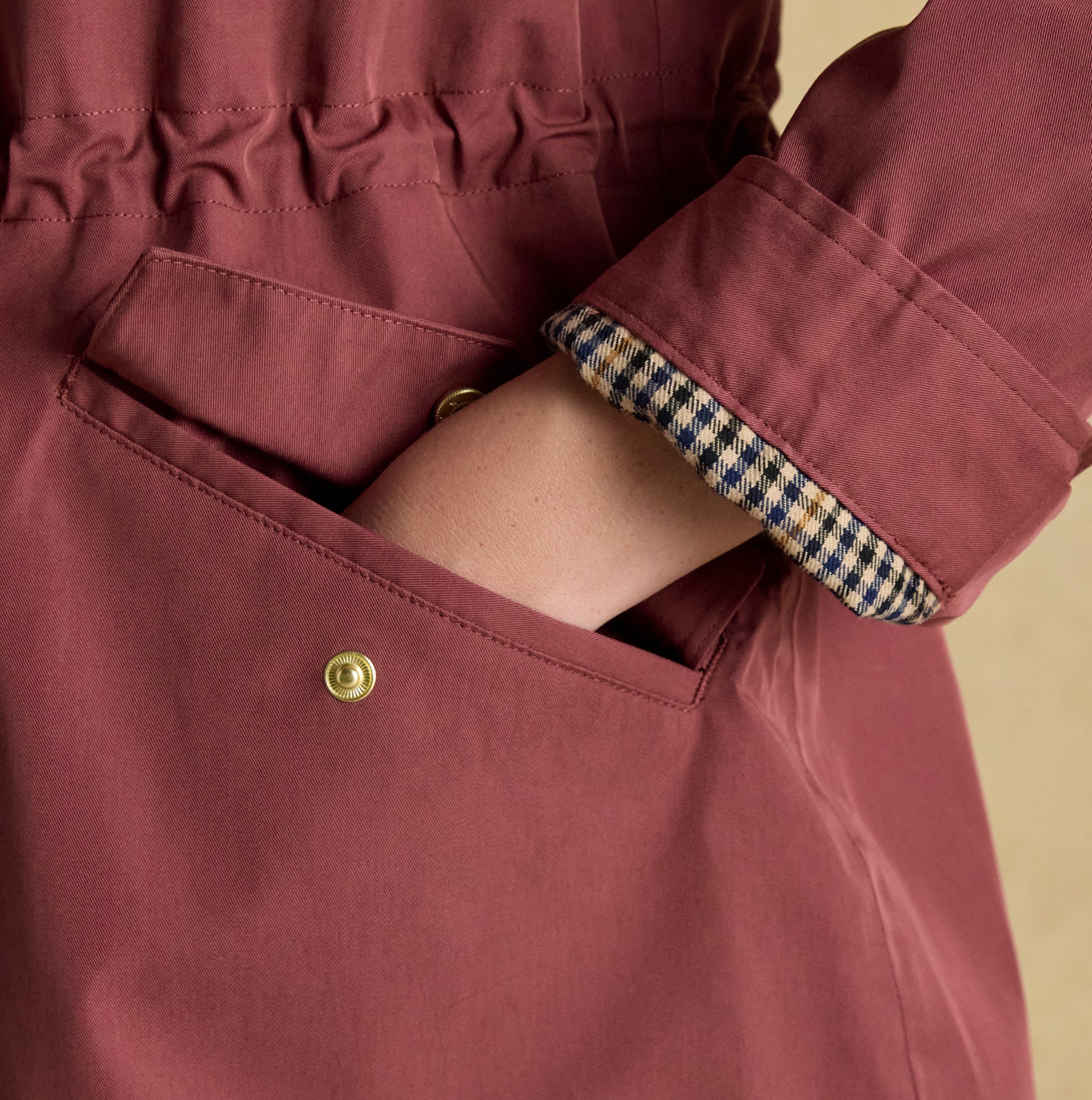 Joules PORTWELL Waterproof Hoodie Raincoat With Adjustable Waist Oxblood detail view of sleeve and pocket.