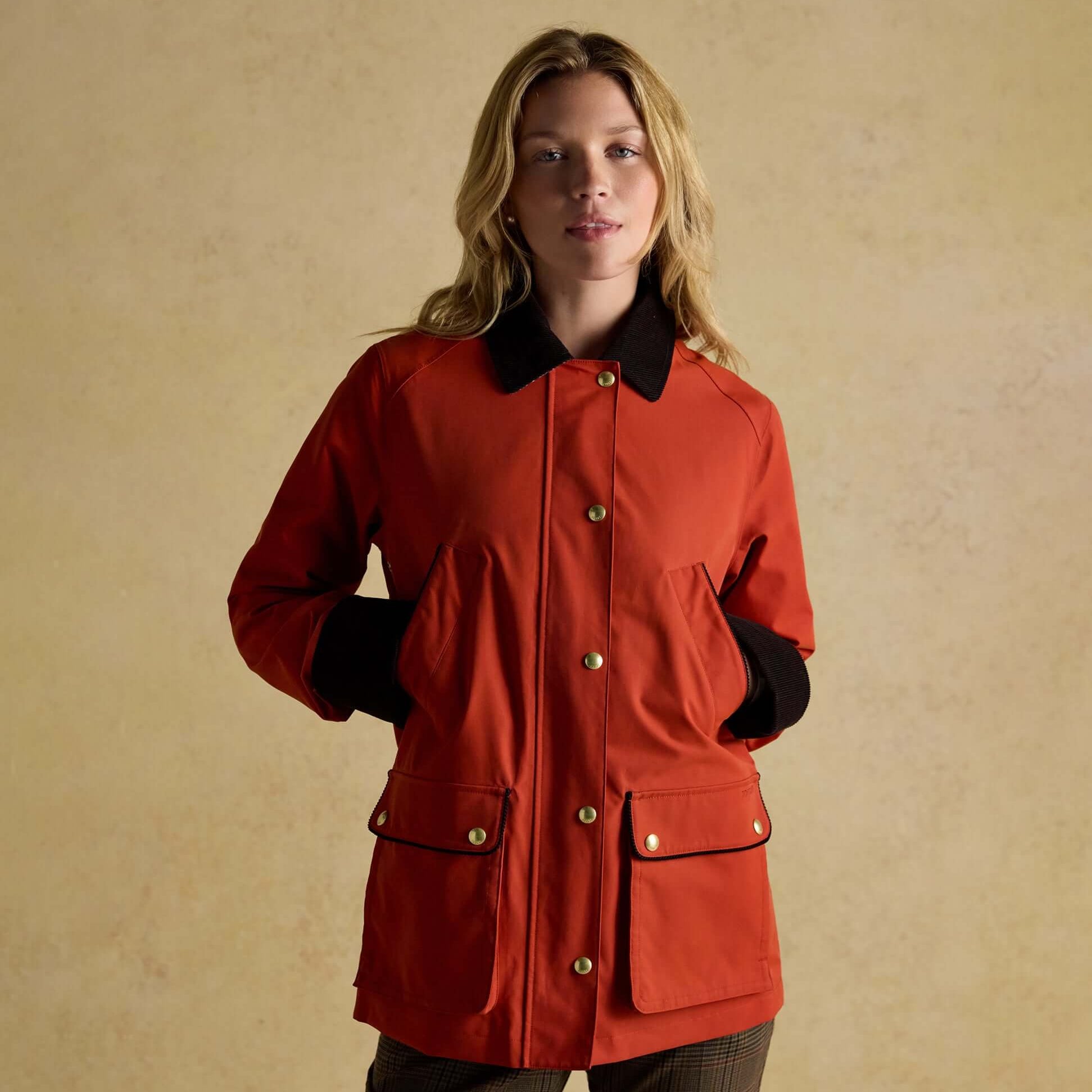 Joules KATHERINE Waterproof Heritage Coat Burnt Orange front view with button closure and side pockets.